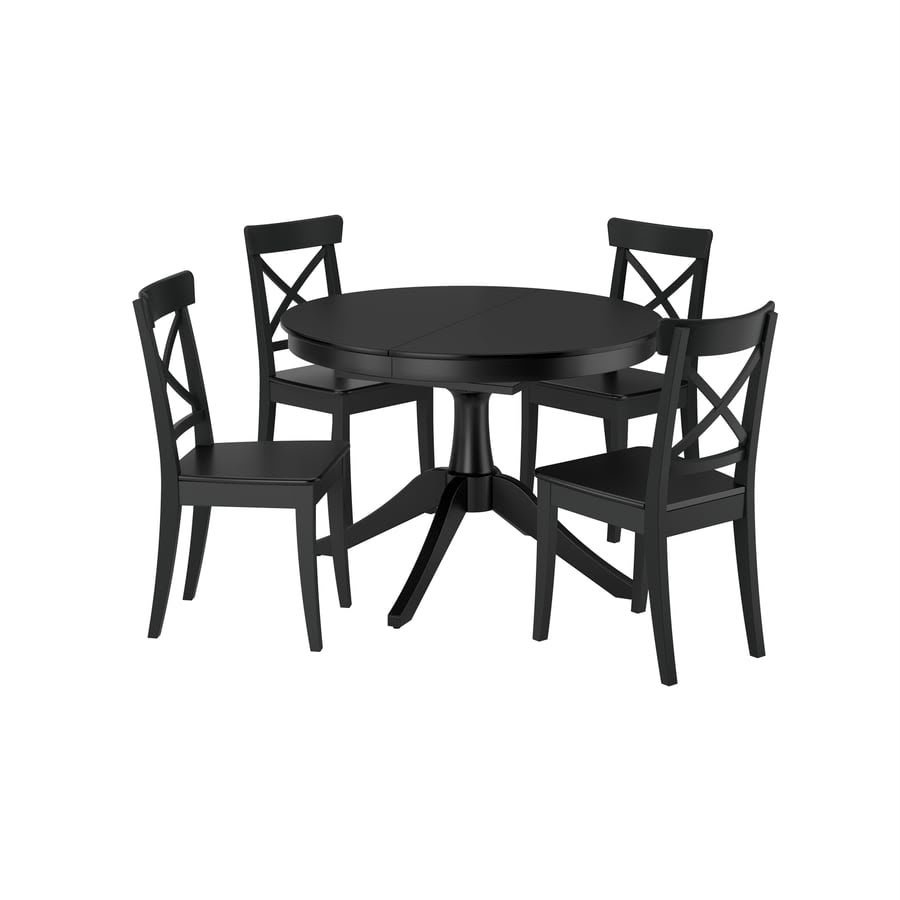 Black wooden round extendable used dining table set with 4 cross back chairs in Abu Dhabi