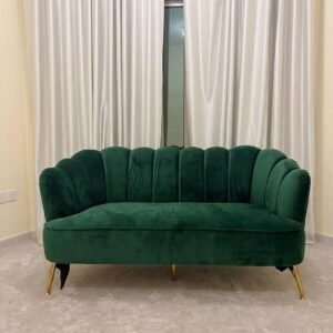 Emerald green velvet 2 seater used sofa with channel tufting and gold legs in Abu Dhabi