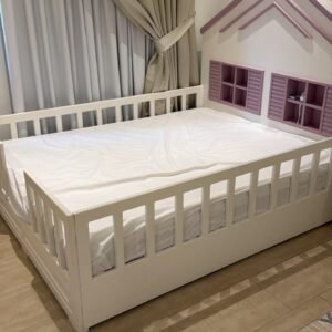 White and purple house shaped wooden used kids bed in Abu Dhabi with safety rails and window headboard shelves