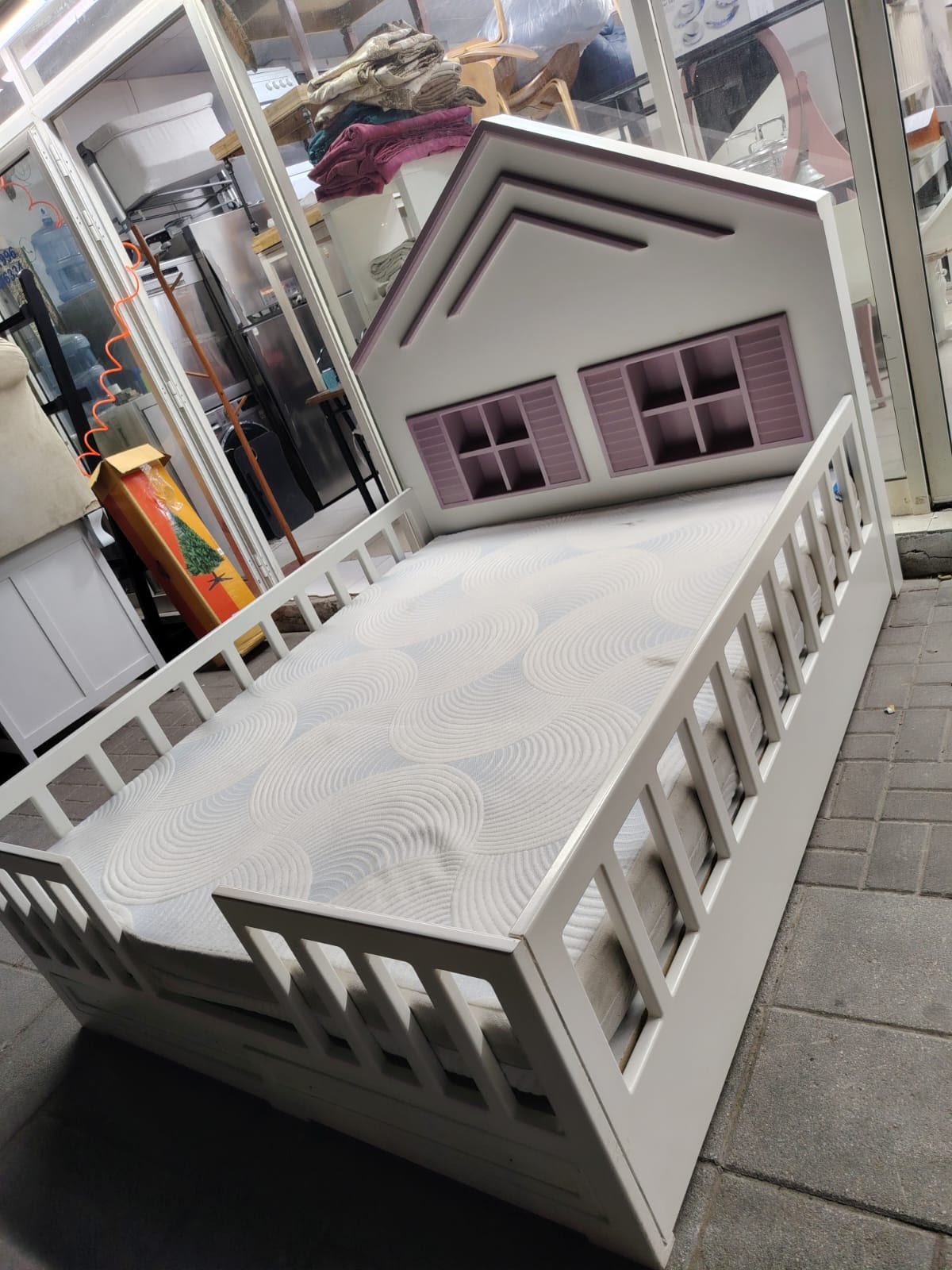 White and purple house shaped wooden used kids bed in Abu Dhabi
