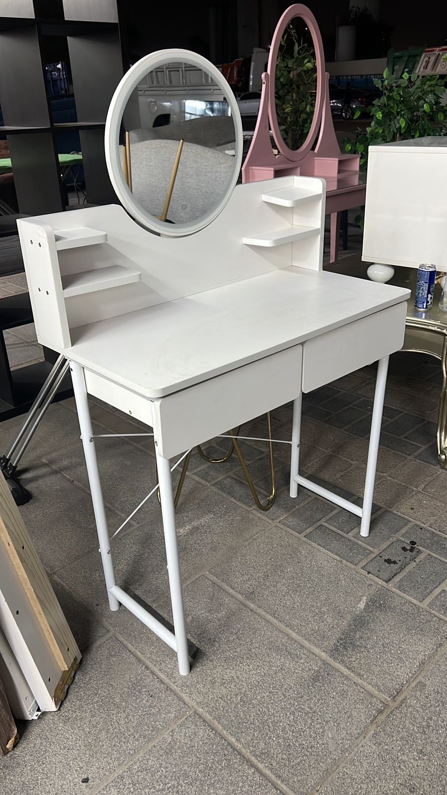 White modern used dressing table with LED oval mirror and drawers at Fairy of Fortune Used Furniture Abu Dhabi