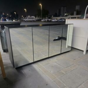 Modern black 4-door mirrored sideboard credenza buffet cabinet with dark interior shelves at Fairy of Fortune Used Furniture Abu Dhabi