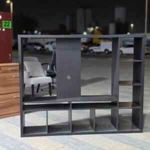 Modern dark grey TV wall unit console with back panel, cubby shelves, and cable hole at Fairy of Fortune Used Furniture Abu Dhabi