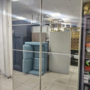 Modern white 2-door sliding wardrobe with full-length mirrored door panel, top shelf, bottom shelf, and clothes hanging section