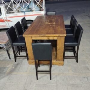 Rustic solid wood high bar table with warm honey finish and 6 black leatherette high bar stools at Fairy of Fortune Used Furniture Abu Dhabi